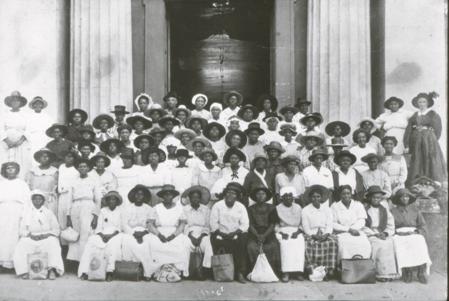 Large group of Black lay midwives gathered on courthouse steps in Canton, Mississippi