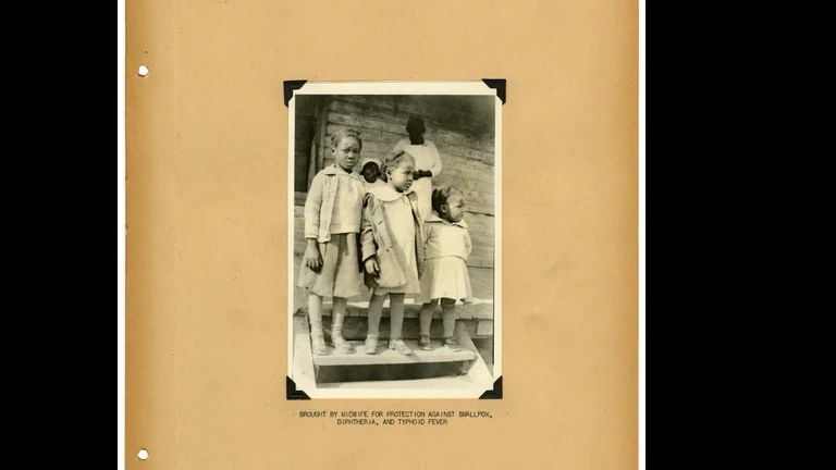Mounted black-and-white group photograph of Mississippi midwives
